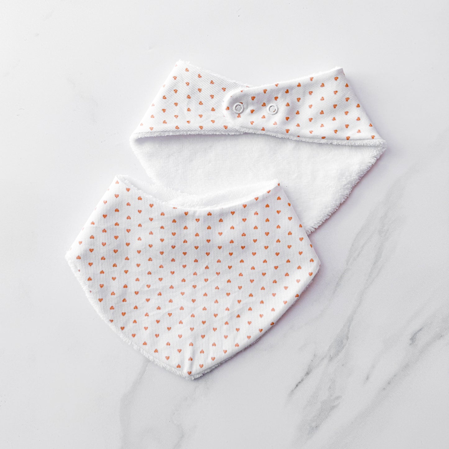 The tiny hearts bib